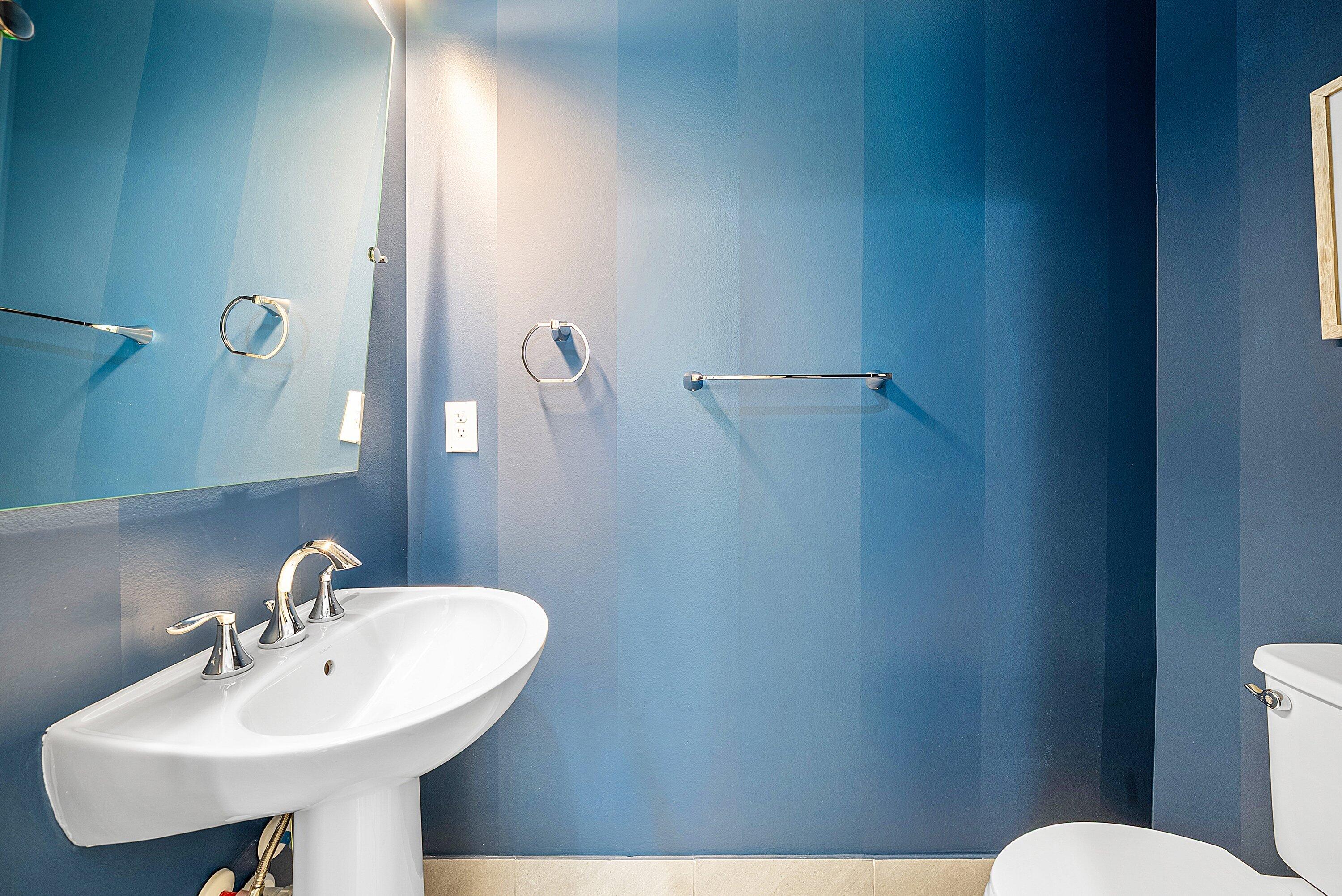 9076 Leon Circle Parkland, FL 33076 - Photo 31 of 42 a bathroom with a sink a toilet and mirror