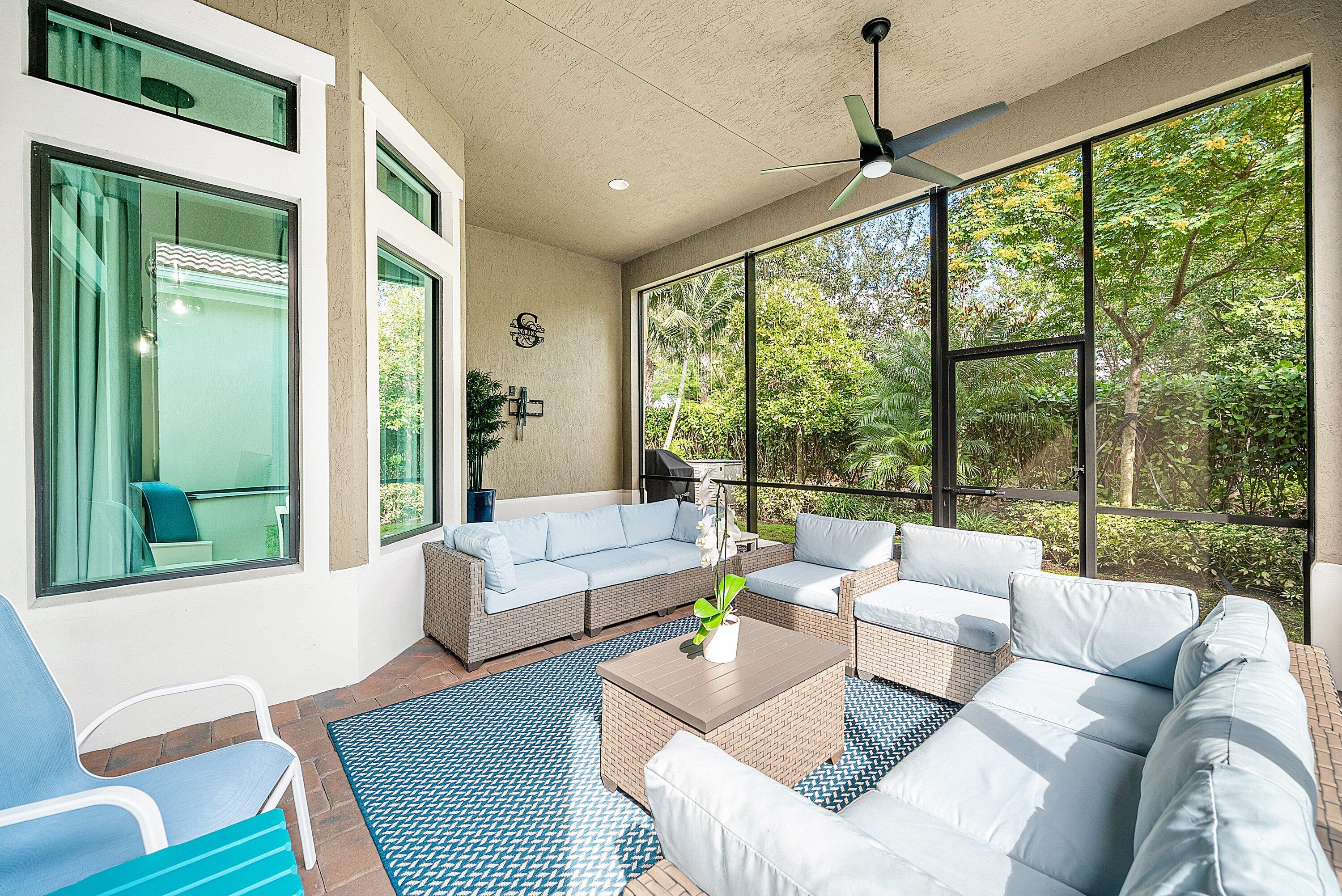 9076 Leon Circle Parkland, FL 33076 - Photo 36 of 42 a living room with furniture and a large window
