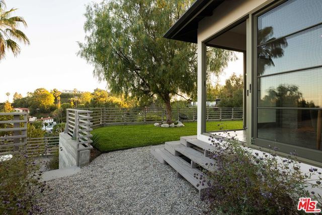 a view of a garden with an outdoor space