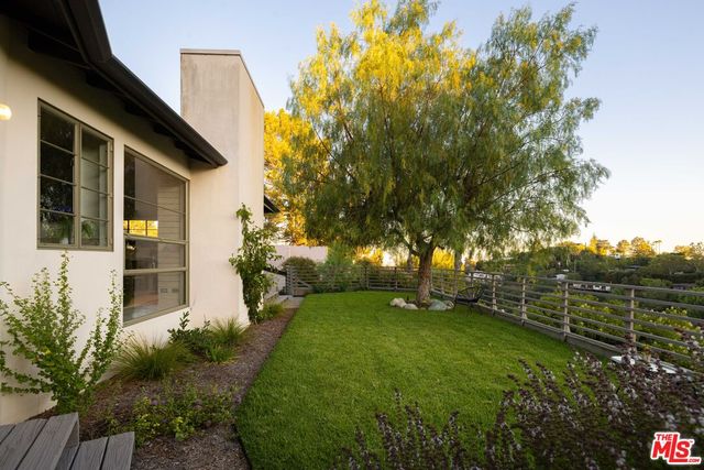 a view of outdoor space with garden and deck