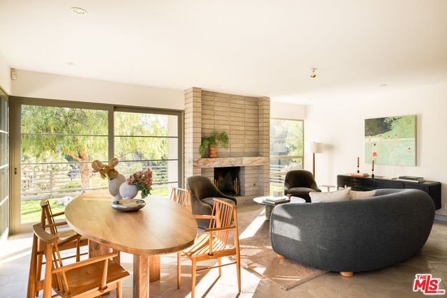 a living room with furniture couches and a fireplace
