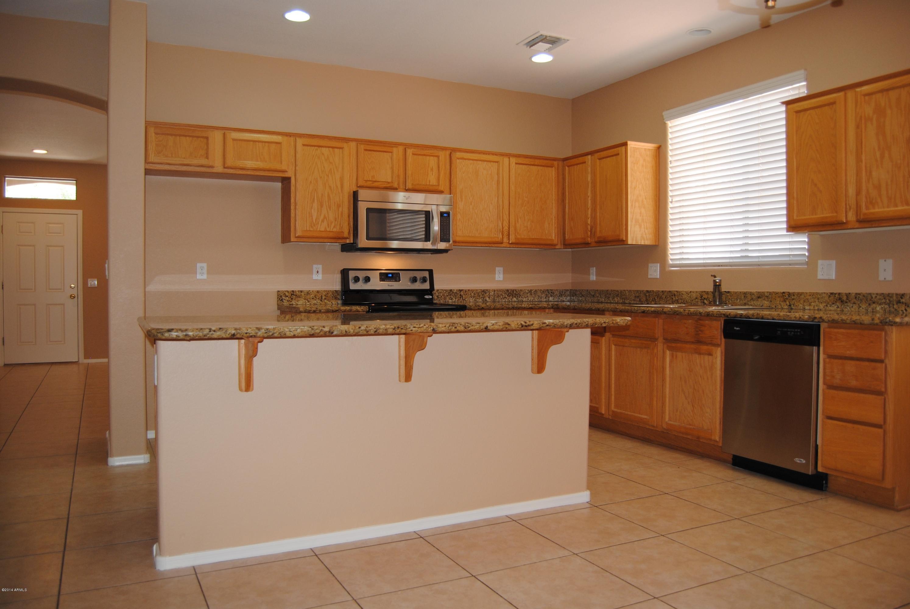 15941 West Calavar Road Surprise, AZ 85379 - Photo 3 of 22 Center Island Kitchen w Stainless!