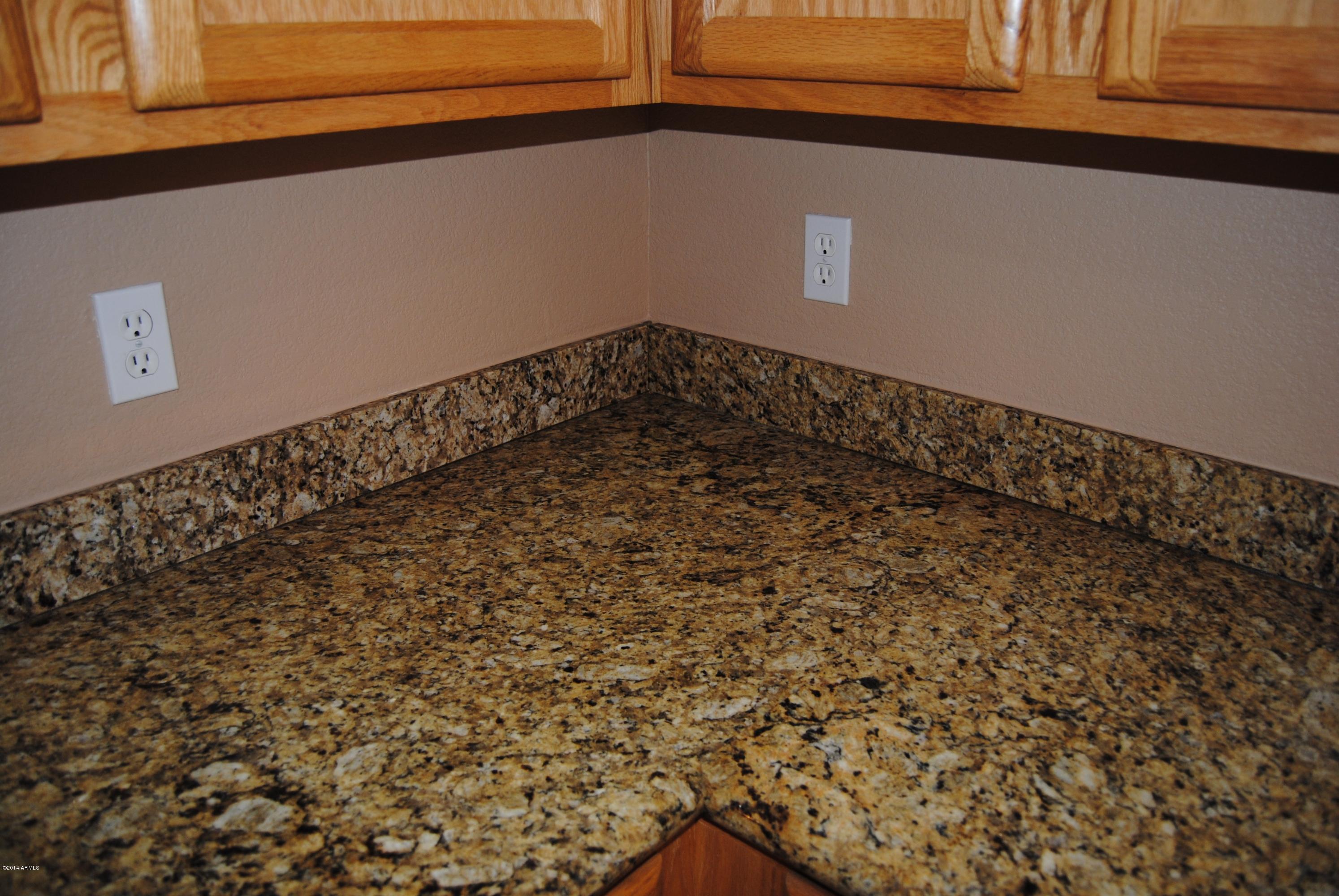 15941 West Calavar Road Surprise, AZ 85379 - Photo 4 of 22 Solid Slab Granite Kitchen Counters