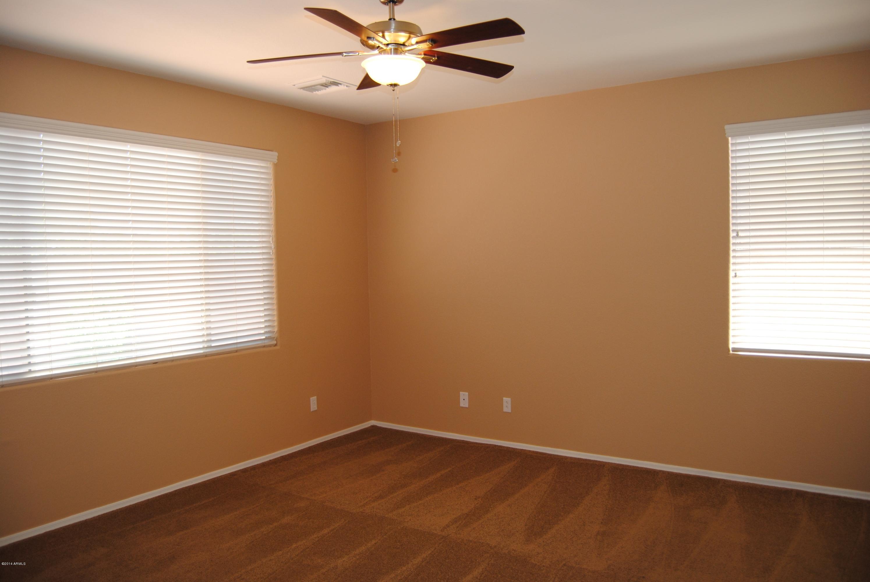 15941 West Calavar Road Surprise, AZ 85379 - Photo 10 of 22 Master Suite w Ceiling Fan