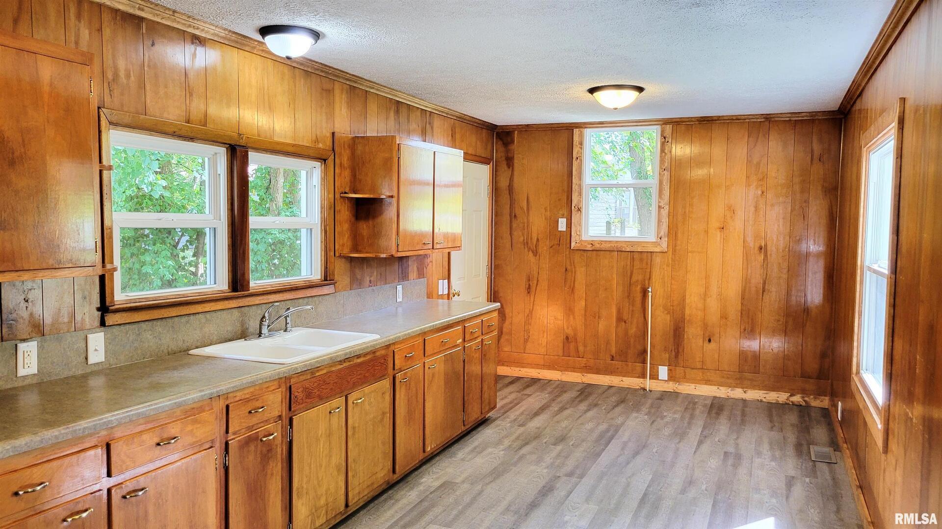 111 Wilmington Avenue Orient, IL 62874 - Photo 13 of 48 a bathroom with a double vanity sink and large window