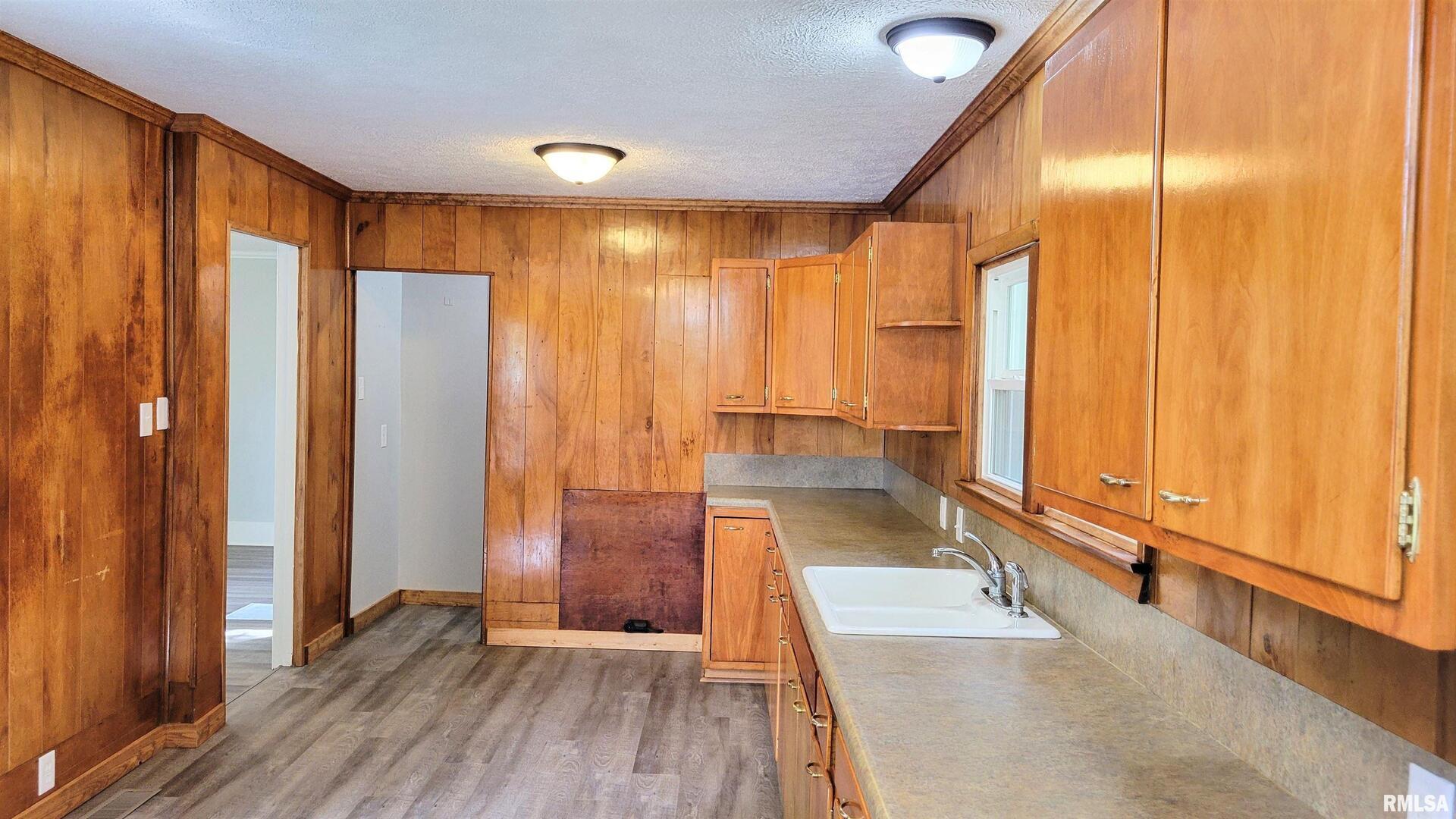111 Wilmington Avenue Orient, IL 62874 - Photo 16 of 48 a view of a room with wooden floor and door