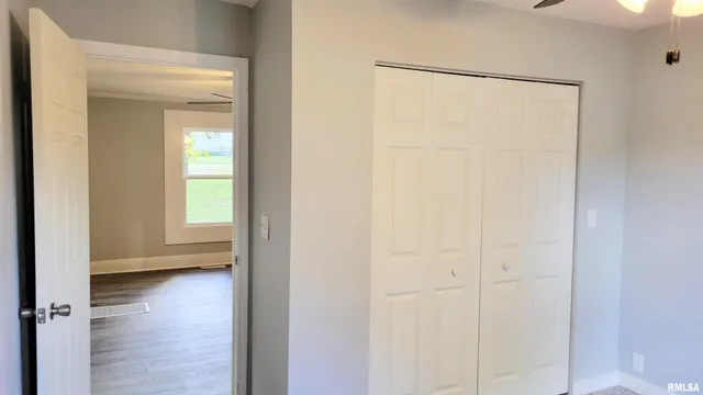 a view of a room with wooden floor