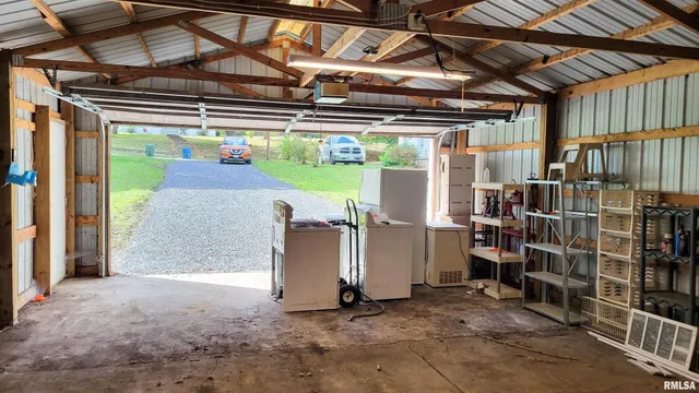 a view of work room with furniture and window