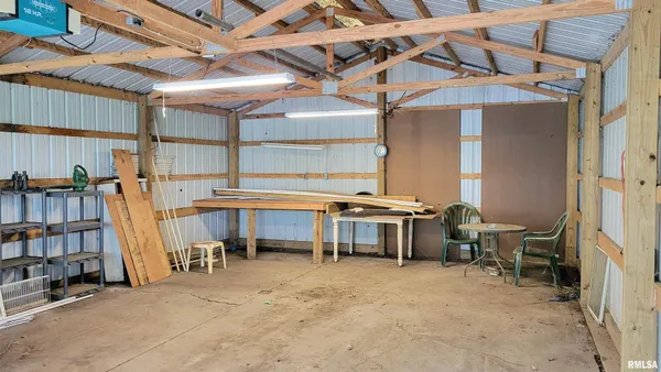 a view of work room with furniture