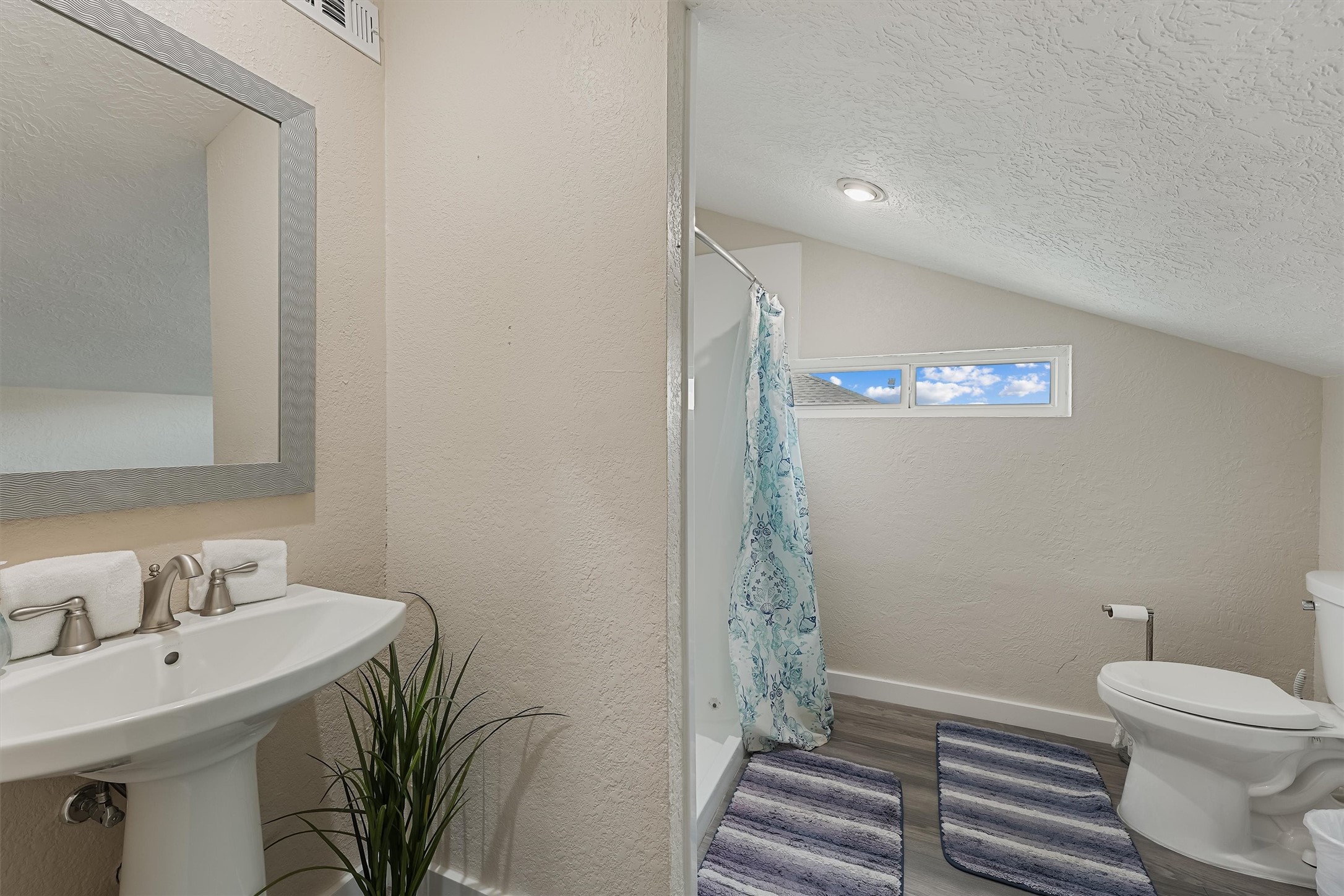 313 Schooner Drive Freeport, TX 77541 - Photo 13 of 30 a bathroom with a sink a toilet and shower