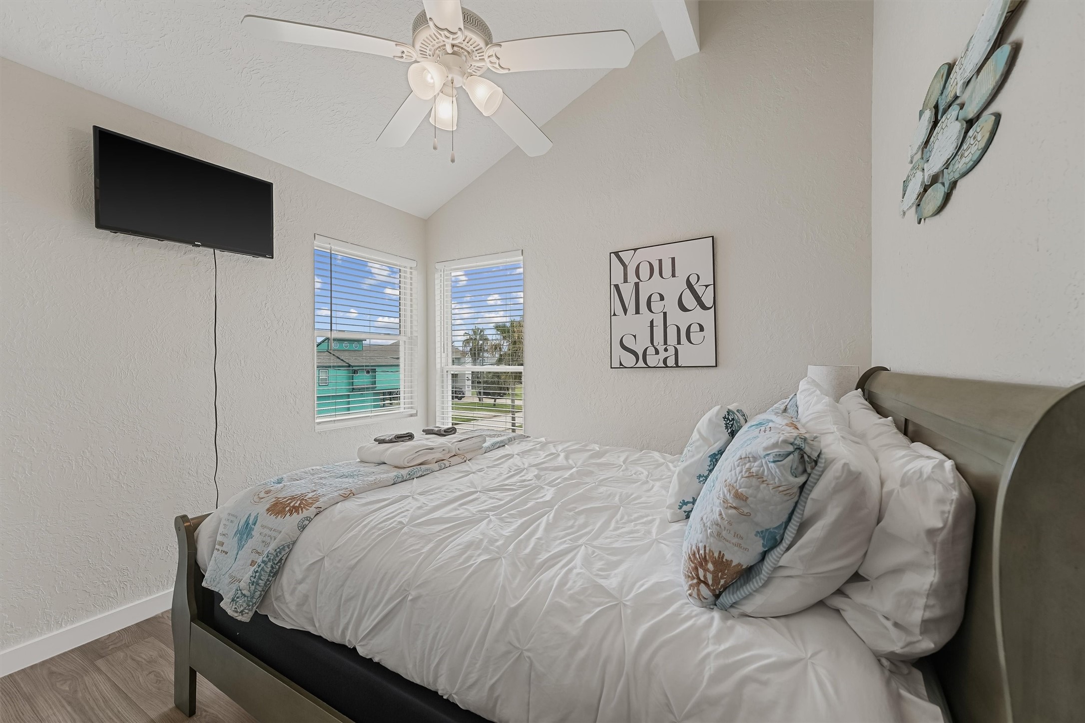 313 Schooner Drive Freeport, TX 77541 - Photo 17 of 30 a bedroom with a large bed and a flat tv screen