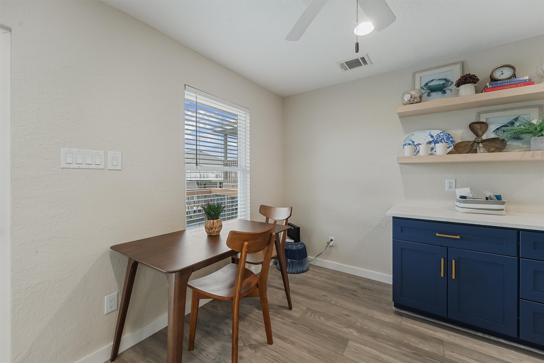 313 Schooner Drive Freeport, TX 77541 - Photo 9 of 30 a view of a workspace with furniture and wooden floor