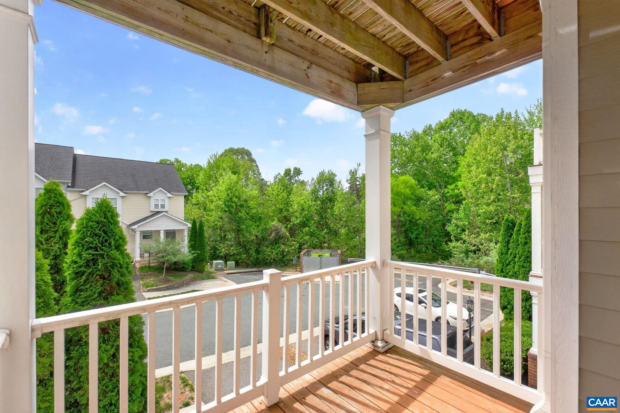 2138 Sundown Place Charlottesville, VA 22911 - Photo 12 of 38 a view of a porch with a floor to ceiling window and wooden fence