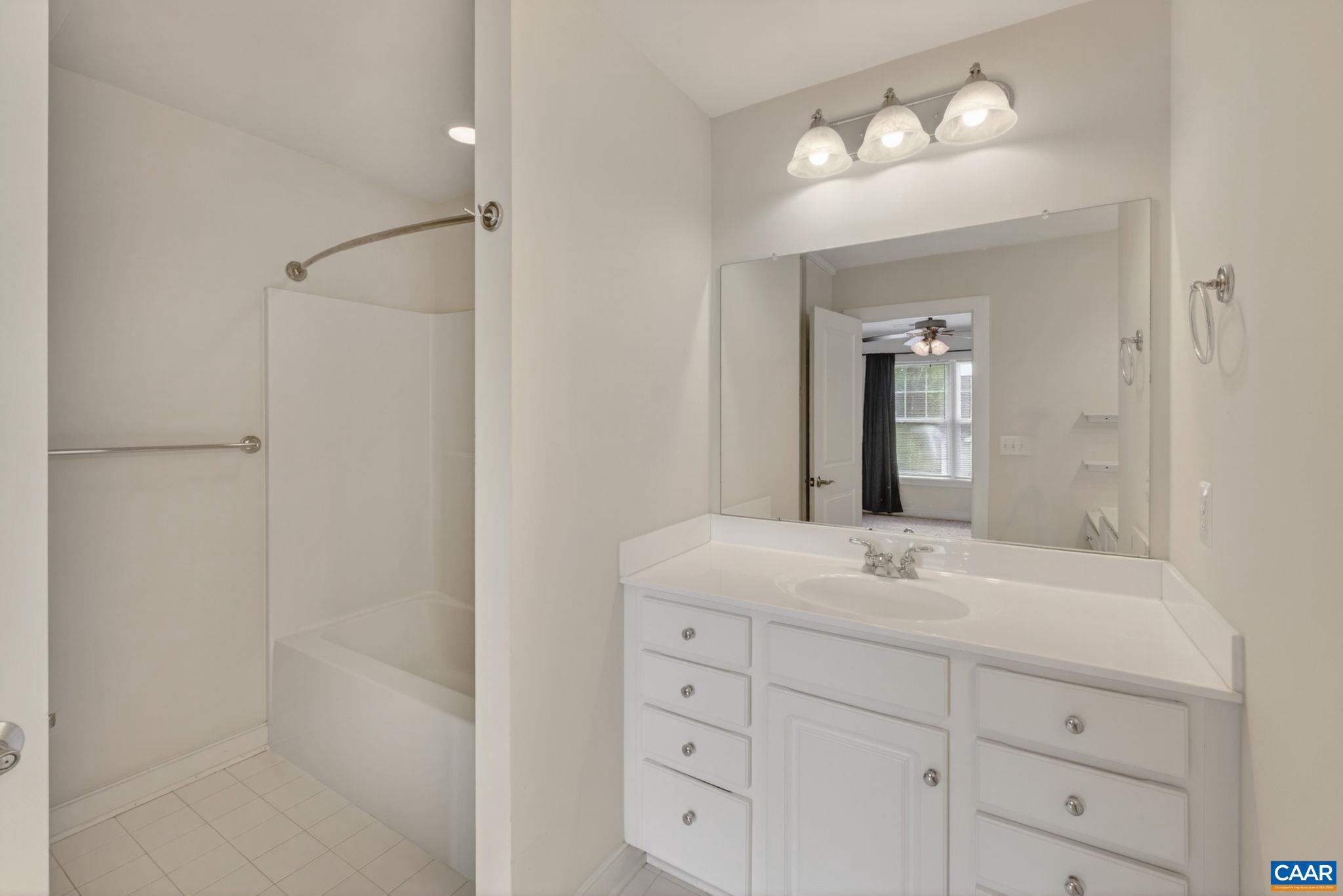 2138 Sundown Place Charlottesville, VA 22911 - Photo 25 of 38 a bathroom with a sink shower and a mirror