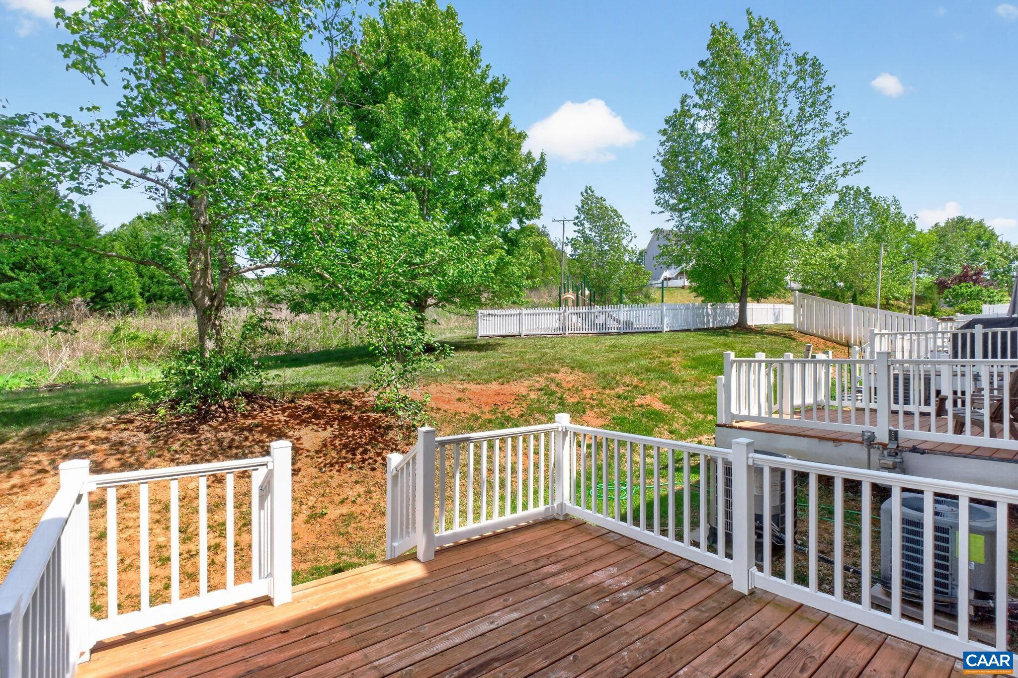 2138 Sundown Place Charlottesville, VA 22911 - Photo 36 of 38 a view of a wooden deck and a yard with swimming pool