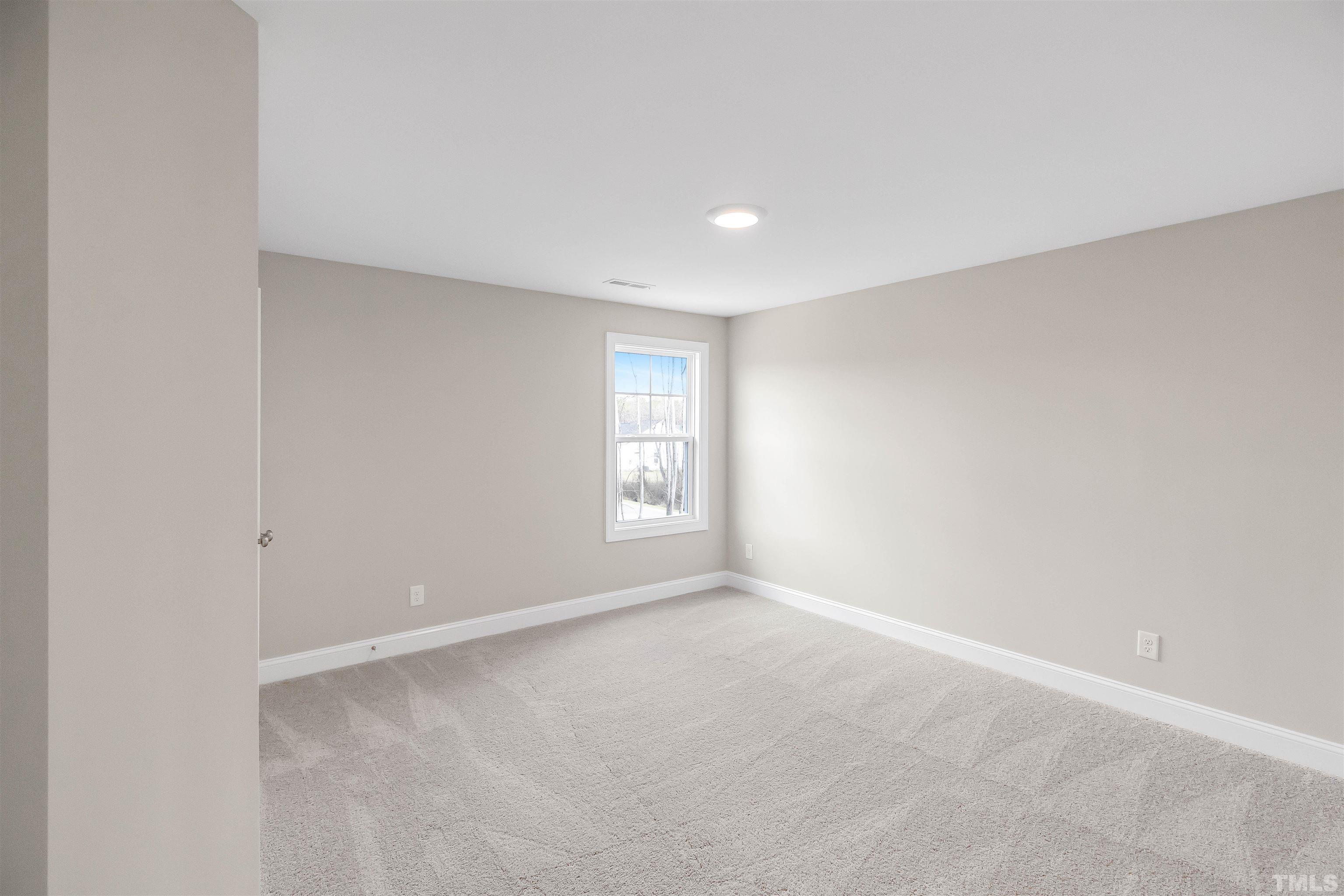 188 Painters Mill Wendell, NC 27591 - Photo 18 of 27 a view of an empty room with a window