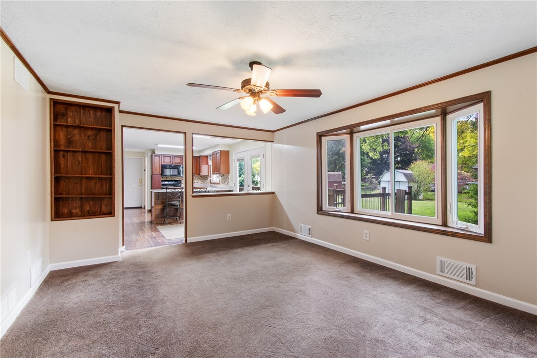 25 Spring Tree Lane Greece, NY 14612 - Photo 14 of 40 Built on bookcase and natural wood trim bring a ru