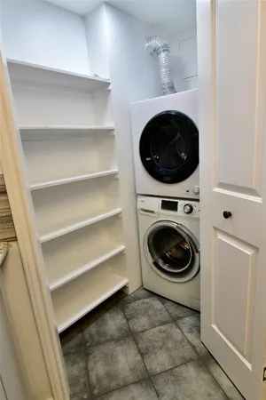 a utility room with washing machine