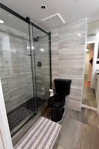 a bathroom with a sink and a shower