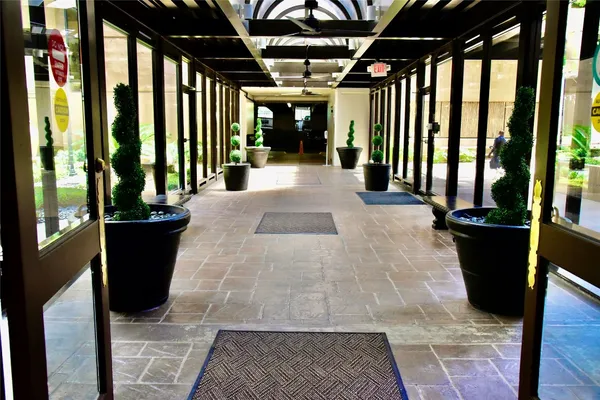 a view of interior space with porch and wooden floor