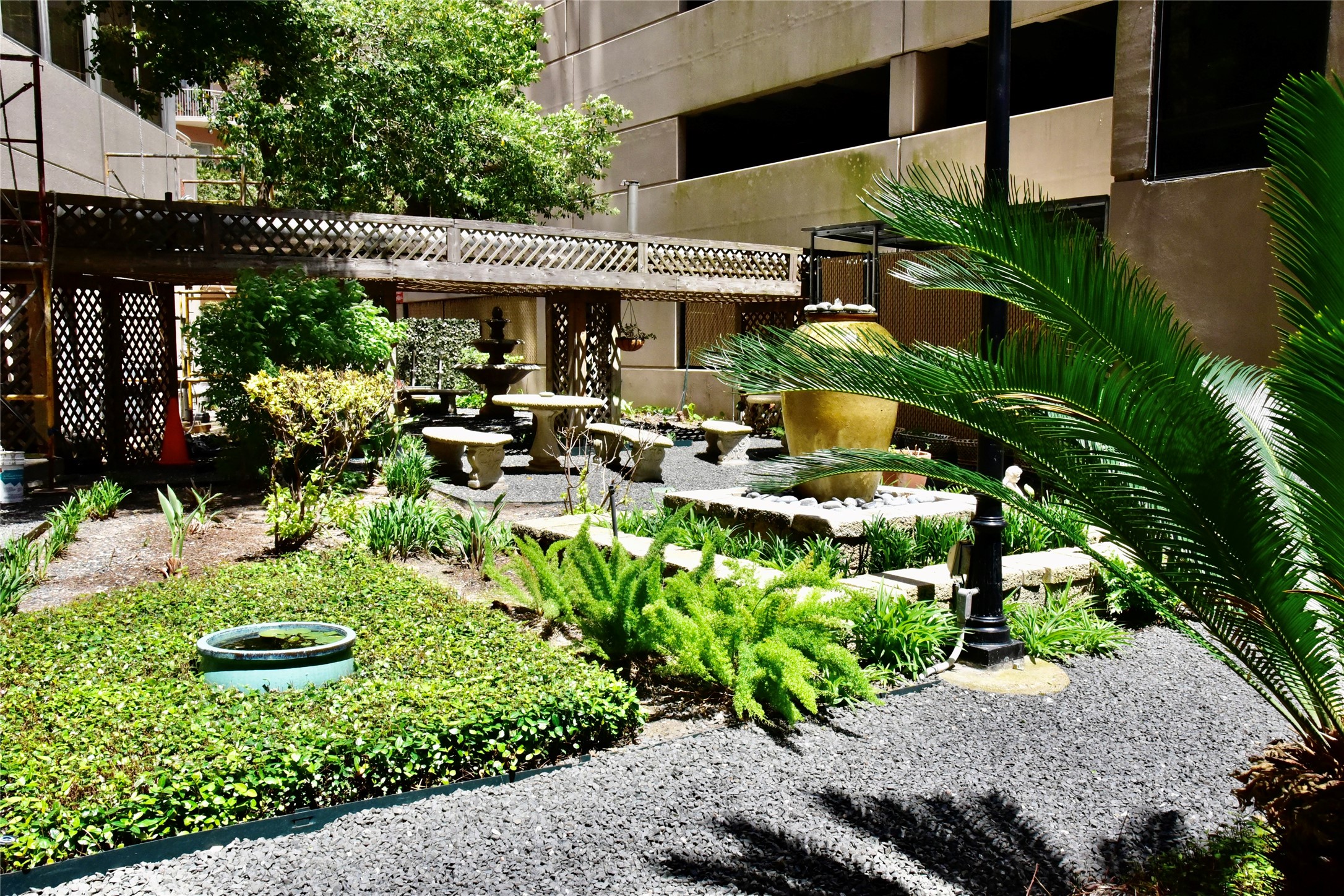 3525 Sage Road, Unit 701 Houston, TX 77056 - Photo 32 of 48 a view of a patio with table and chairs potted plants