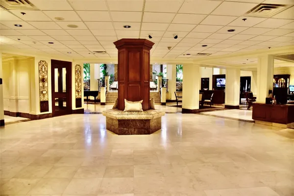 a view of a hall with many windows