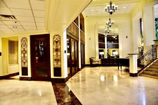 a view of a patio with a table and chairs