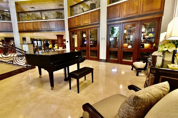 a view of a chairs and tables in a patio