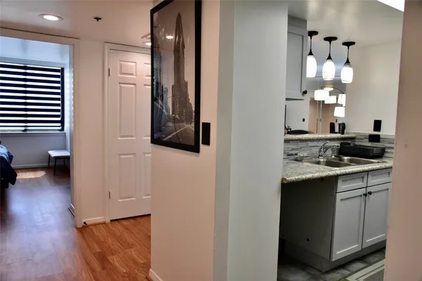 a kitchen with a sink and cabinets