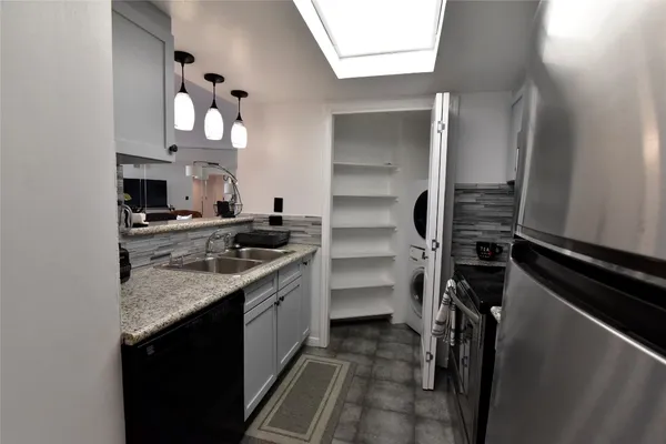 a kitchen with a sink and cabinets