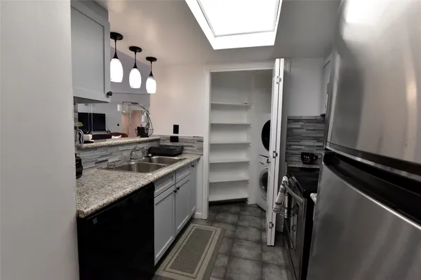 a kitchen with a sink and cabinets