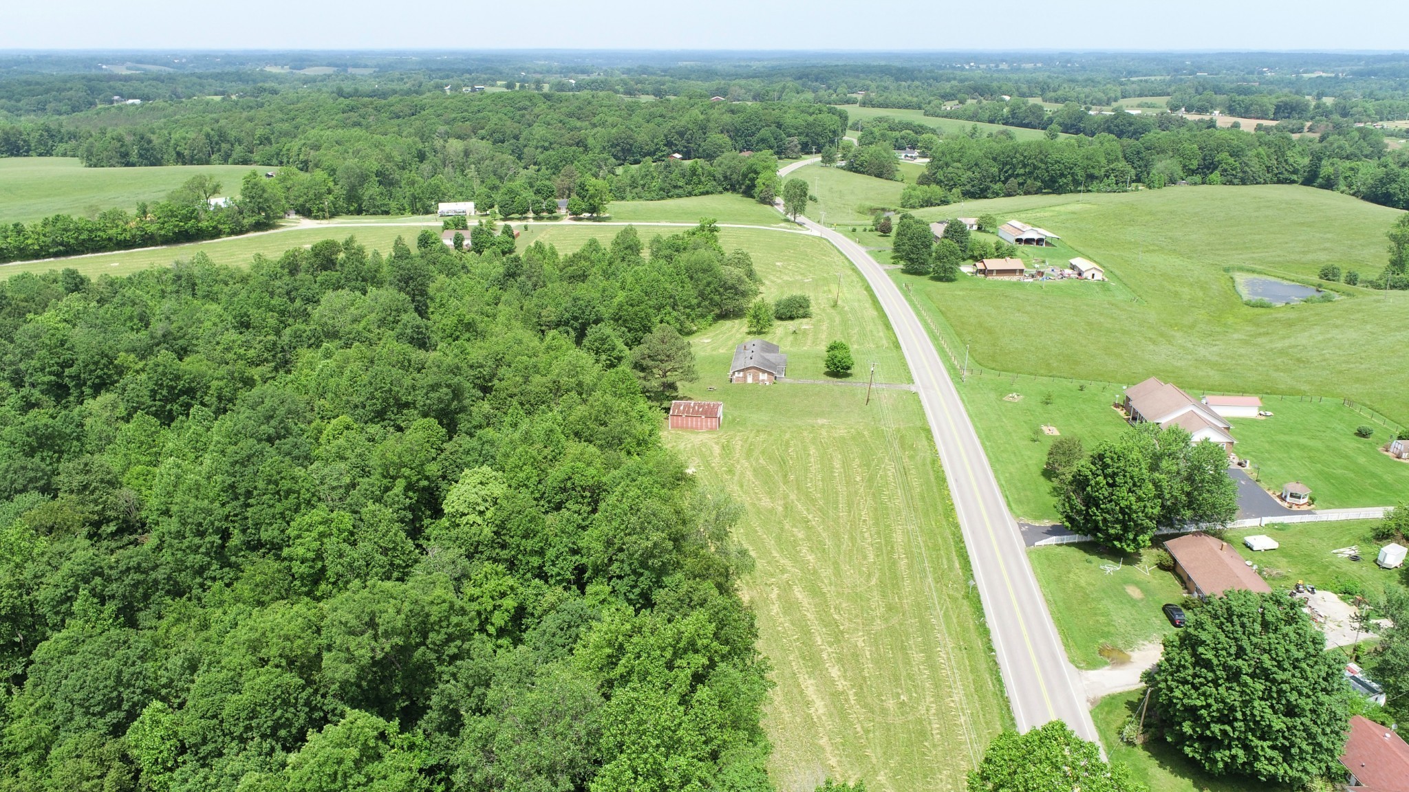 7 Whitson Hollow Road Red Boiling Springs, TN 37150 - Photo 4 of 5 an aerial view of green landscape with trees houses and mountain view