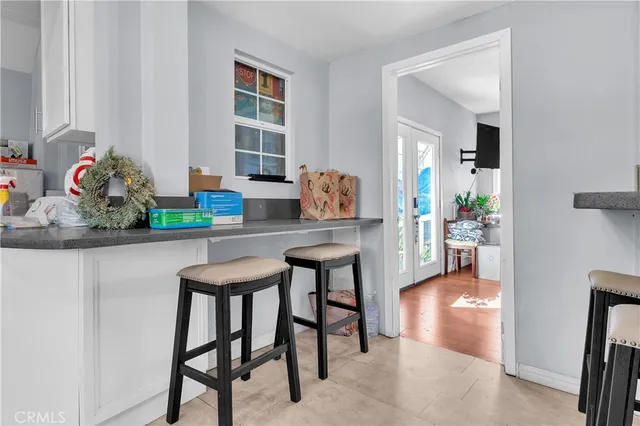 a kitchen with stainless steel appliances granite countertop a refrigerator and a refrigerator