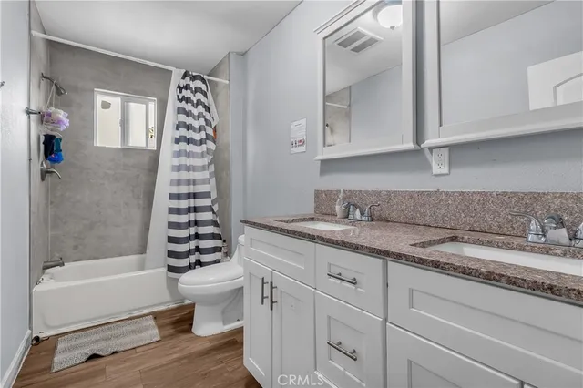 a view of hallway with wooden floor