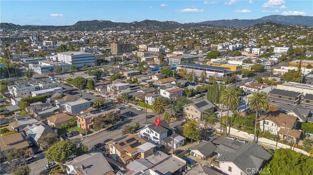 a view of multiple houses with a yard