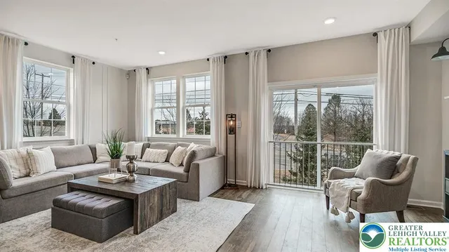 a living room with furniture and a large window