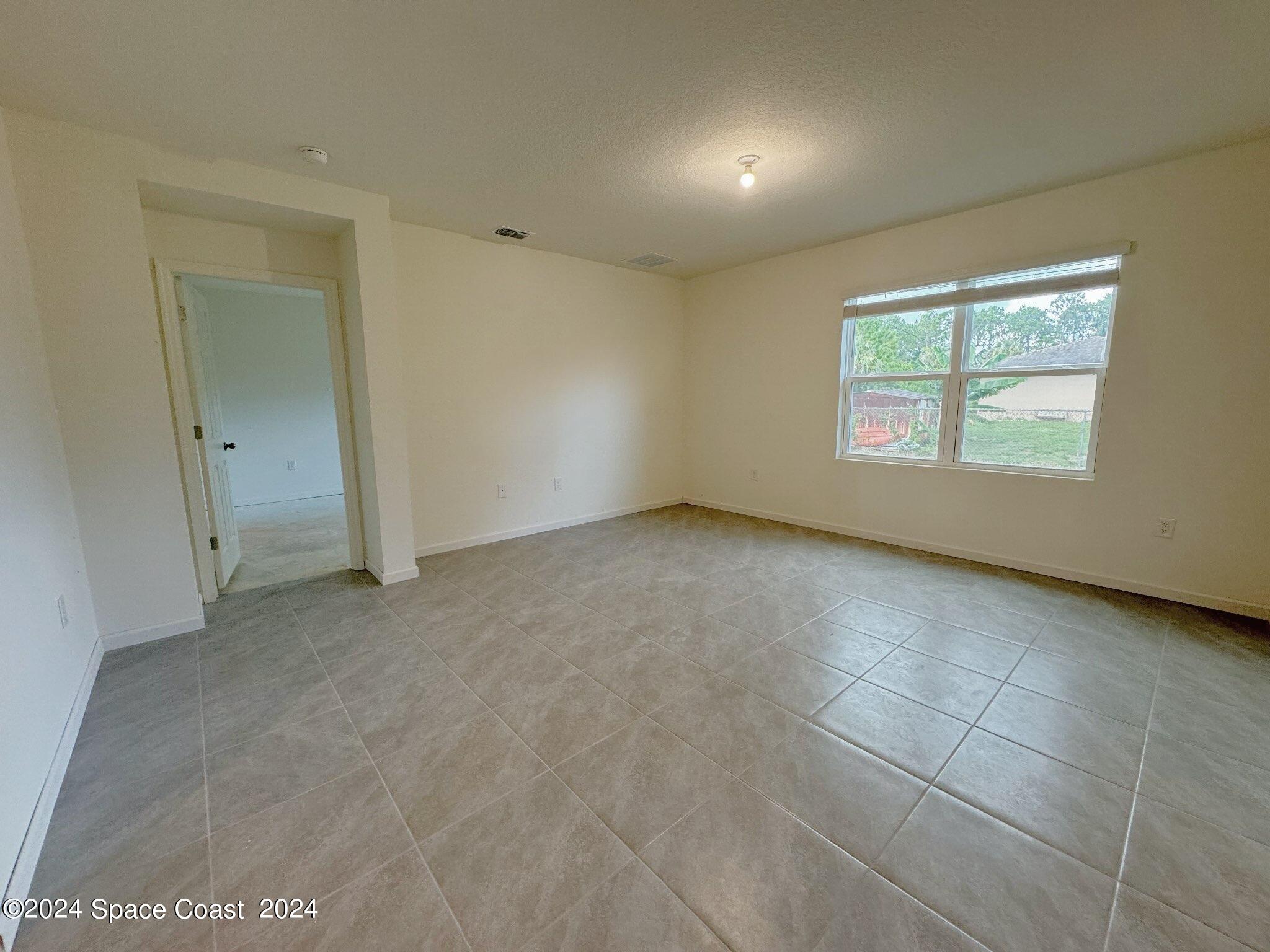435 Oakleaf Street Southwest Palm Bay, FL 32908 - Photo 12 of 44 12. 435 Oakleaf - Family Room