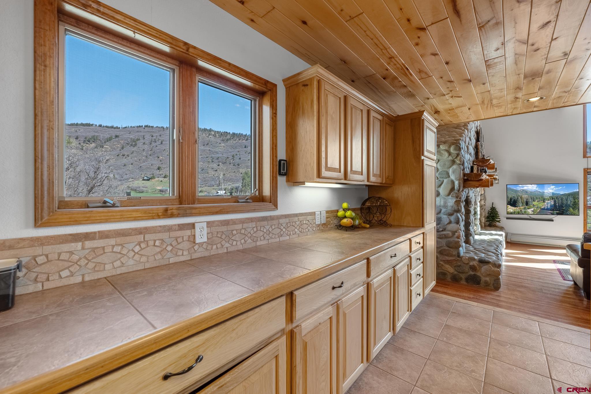 26 Severn Peak Road Bayfield, CO 81122 - Photo 13 of 36 a kitchen with a sink and large window