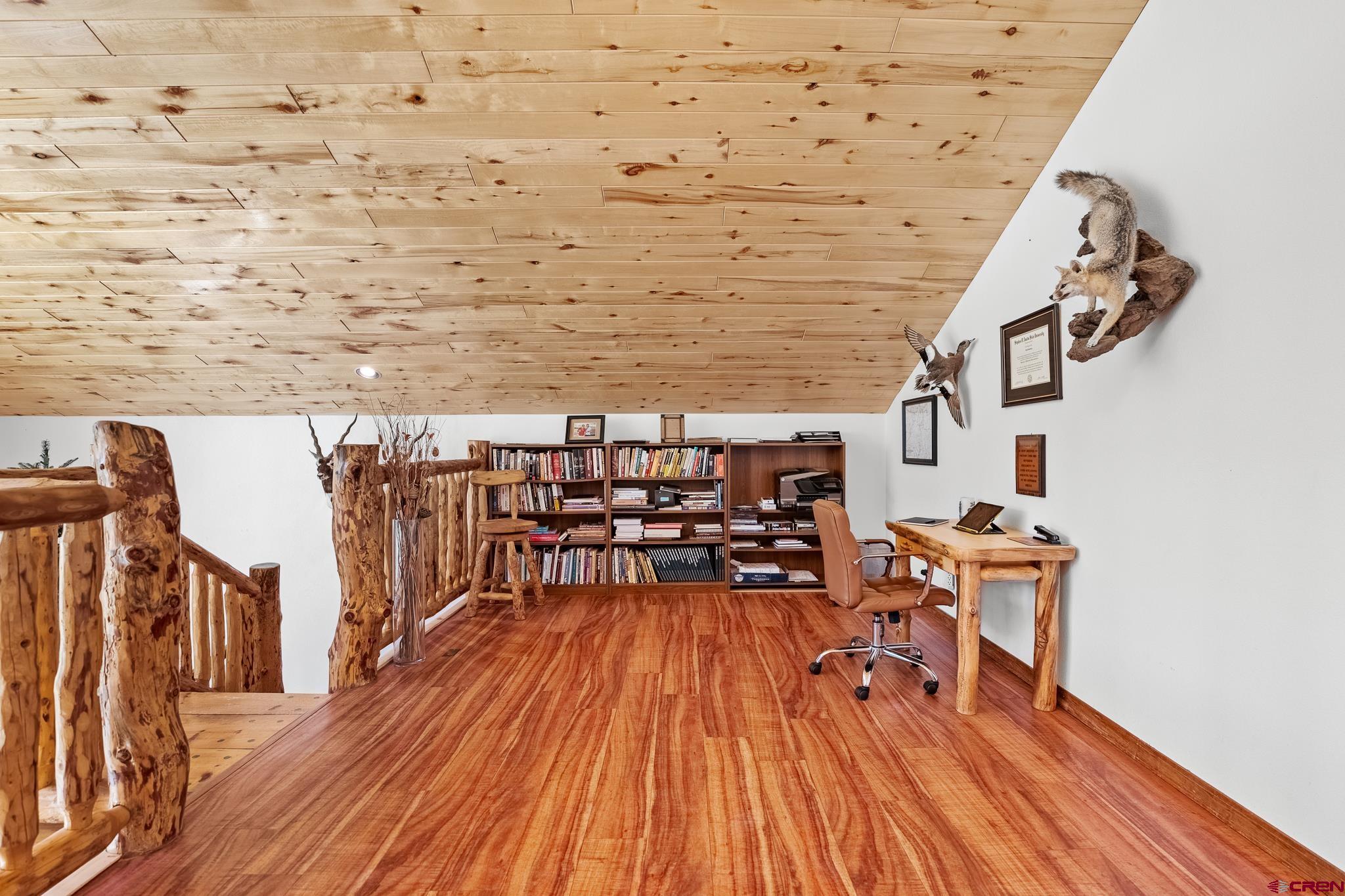 26 Severn Peak Road Bayfield, CO 81122 - Photo 19 of 36 a dining room with furniture and wooden floor