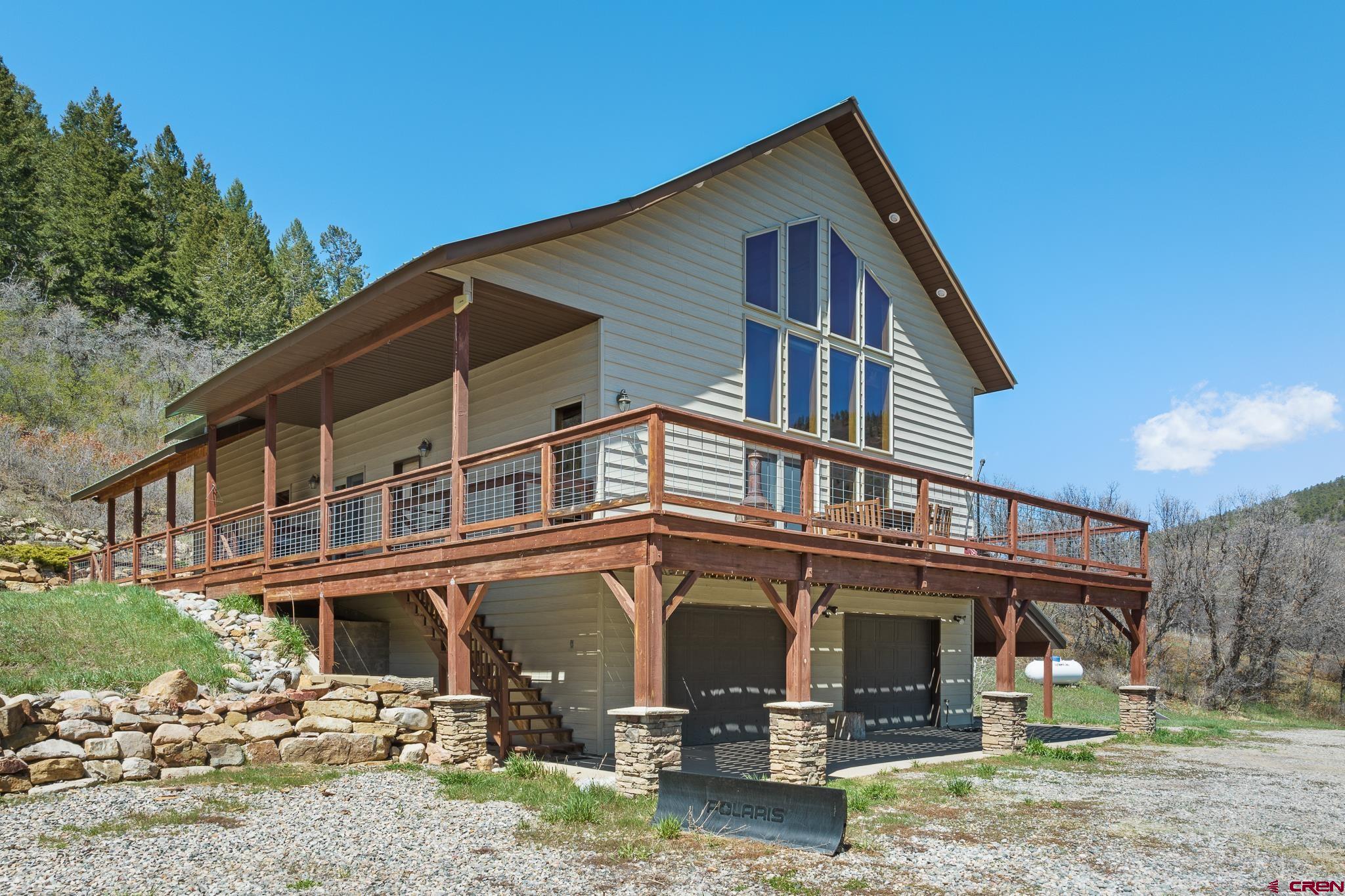 26 Severn Peak Road Bayfield, CO 81122 - Photo 2 of 36 a front view of a house with a yard