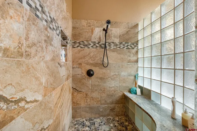 a view of a storage and utility room with closet fan
