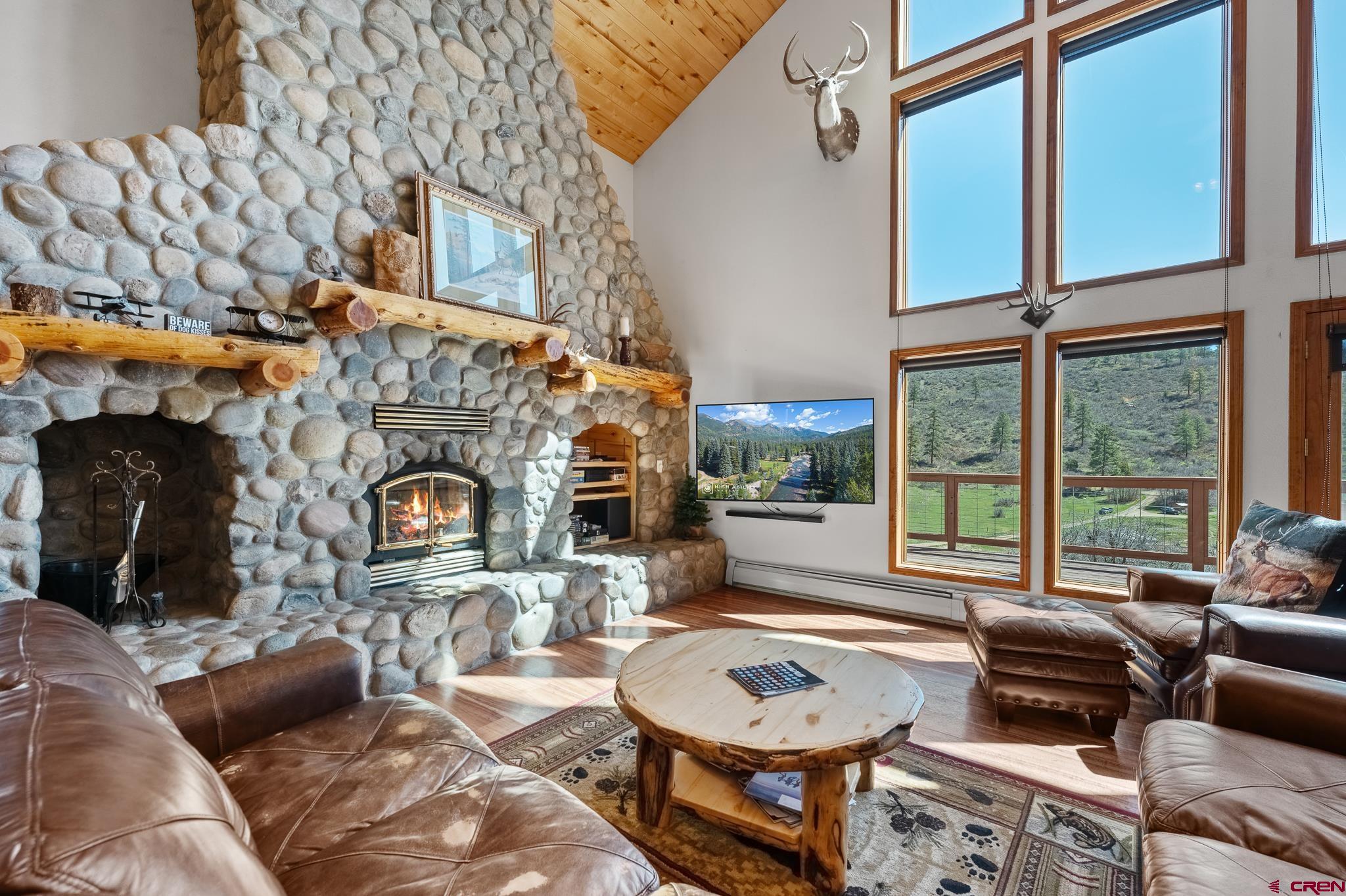 26 Severn Peak Road Bayfield, CO 81122 - Photo 6 of 36 a living room with furniture and a fireplace