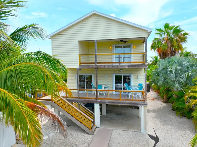 a room with a door open to a room