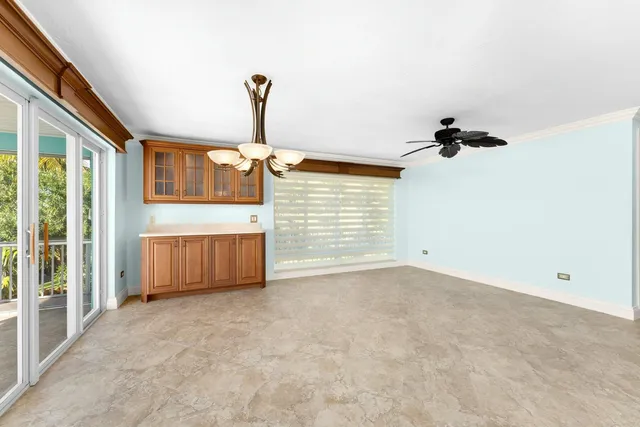 a utility room with cabinets washer and dryer