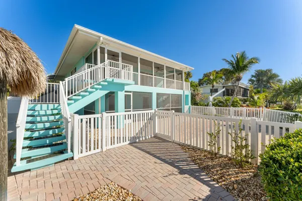 a front view of a house with a lake view