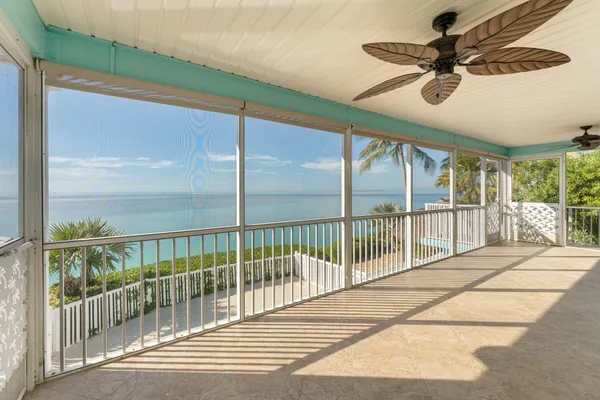 a view of a swimming pool with a sitting area