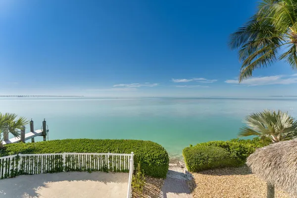 an aerial view of a house with a ocean view