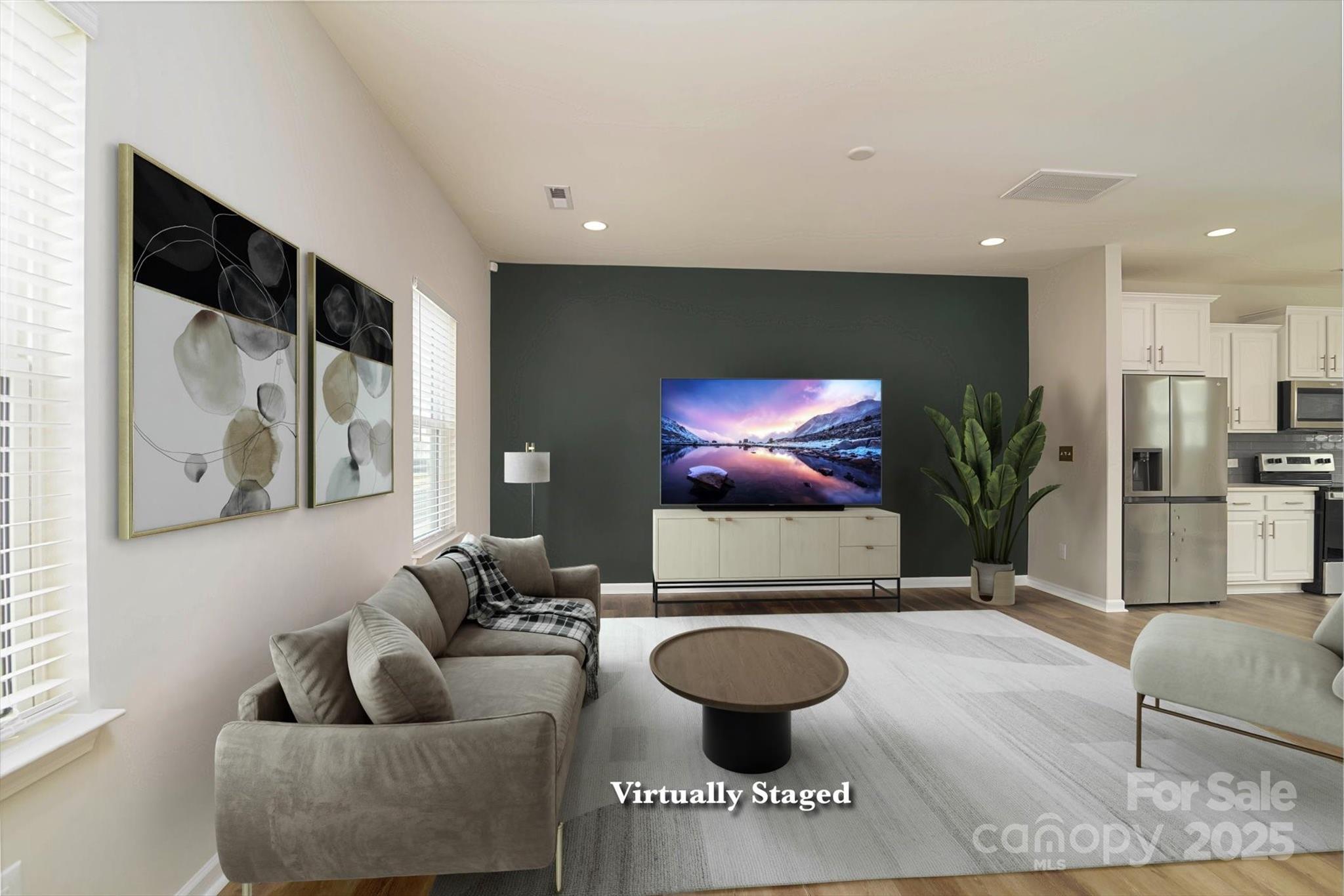 a living room with furniture and a flat screen tv