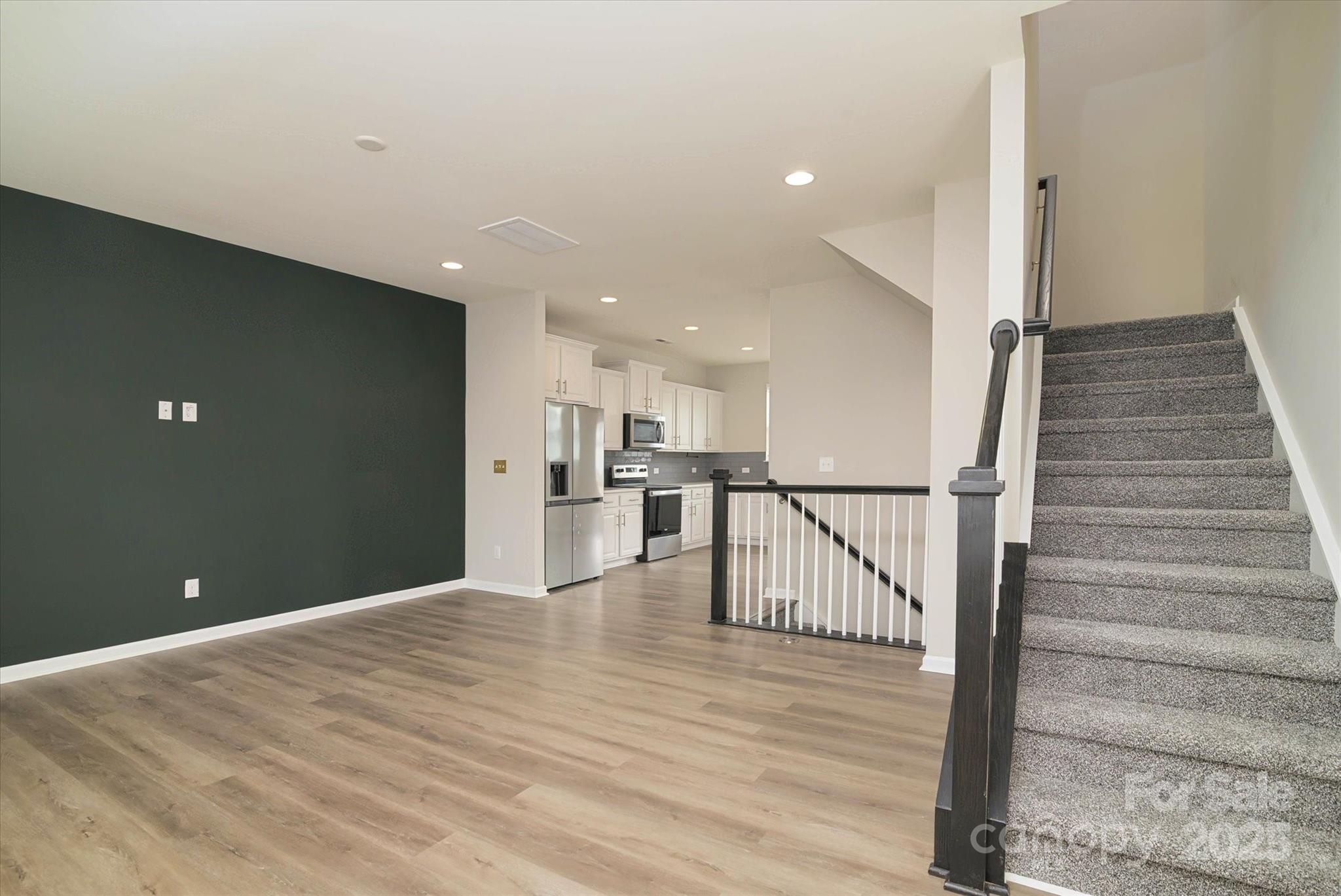 13304 Porter Creek Road Charlotte, NC 28262 - Photo 13 of 22 a view of a hallway with wooden floor