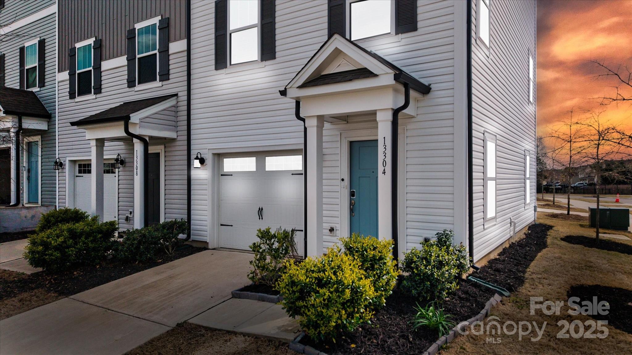 13304 Porter Creek Road Charlotte, NC 28262 - Photo 3 of 22 a front view of a house with garden